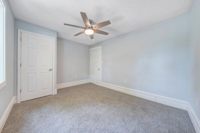 3311 Memorial Ave, Lynchburg, VA 24501 - unfurnished bedroom featuring carpet, a textured ceiling, ceiling fan, and a closet
