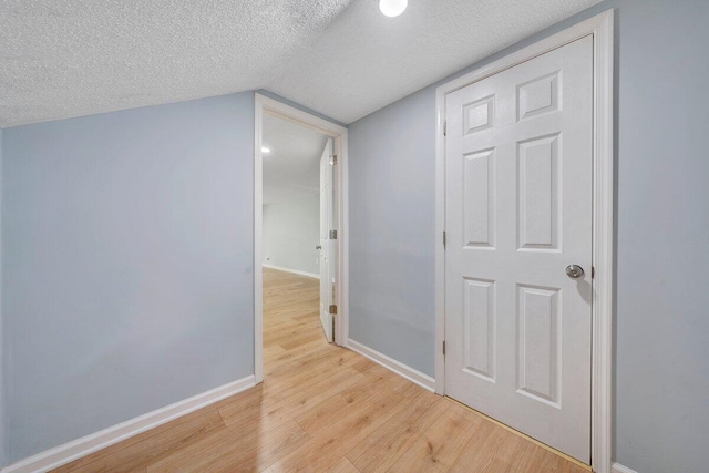 3311 Memorial Ave, Lynchburg, VA 24501 - hall with light wood-type flooring, a textured ceiling, and lofted ceiling