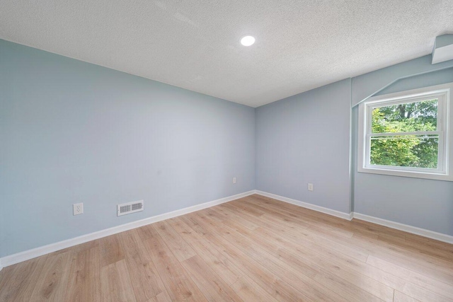 3311 Memorial Ave, Lynchburg, VA 24501 - unfurnished room featuring a textured ceiling, light wood-style flooring, and recessed lighting