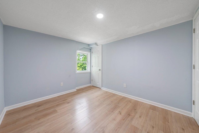 3311 Memorial Ave, Lynchburg, VA 24501 - empty room featuring a textured ceiling, light wood finished floors, and recessed lighting