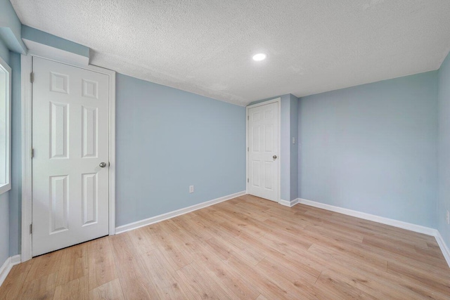 3311 Memorial Ave, Lynchburg, VA 24501 - unfurnished bedroom with wood finished floors, a textured ceiling, and recessed lighting