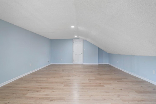 3311 Memorial Ave, Lynchburg, VA 24501 - additional living space featuring a textured ceiling, lofted ceiling, light wood-style flooring, and recessed lighting