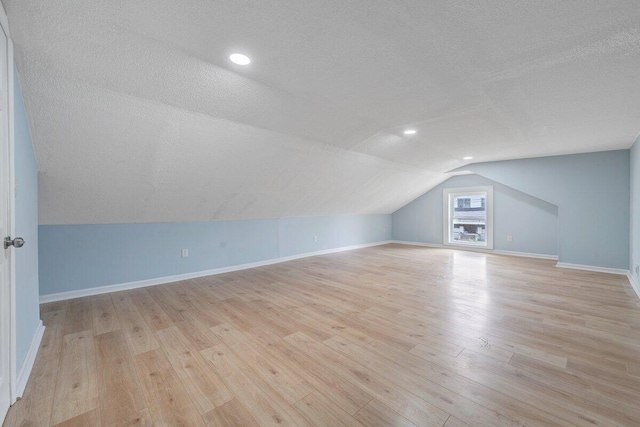 3311 Memorial Ave, Lynchburg, VA 24501 - additional living space with a textured ceiling, vaulted ceiling, light wood-type flooring, and recessed lighting