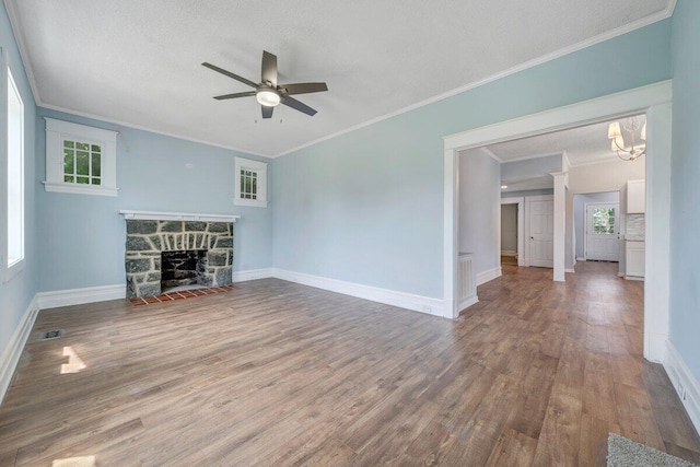 3311 Memorial Ave, Lynchburg, VA 24501 - unfurnished living room with wood finished floors, a ceiling fan, ornamental molding, a fireplace, and a chandelier