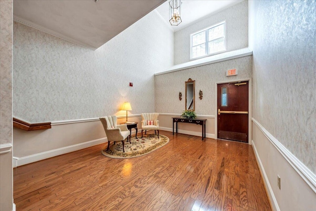 2208 Jefferson St SE Unit 104, Roanoke, VA 24014 - sitting room featuring wood finished floors, a high ceiling, and ornamental molding