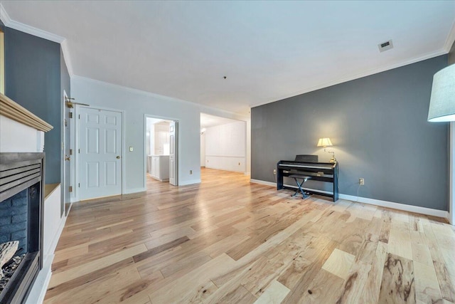 2208 Jefferson St SE Unit 104, Roanoke, VA 24014 - unfurnished living room featuring a fireplace, crown molding, light wood-style floors, and baseboards