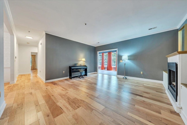 2208 Jefferson St SE Unit 104, Roanoke, VA 24014 - unfurnished living room featuring a fireplace, light wood-style flooring, ornamental molding, and baseboards