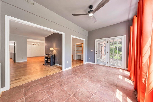 2208 Jefferson St SE Unit 104, Roanoke, VA 24014 - unfurnished room with a chandelier, ceiling fan, wood finished floors, and baseboards