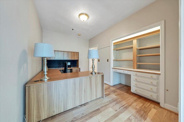 2208 Jefferson St SE Unit 104, Roanoke, VA 24014 - unfurnished office featuring built in desk, light wood-type flooring, and baseboards