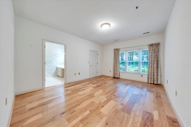 2208 Jefferson St SE Unit 104, Roanoke, VA 24014 - spare room featuring light wood-type flooring, baseboards, and fire sprinkler in ceiling