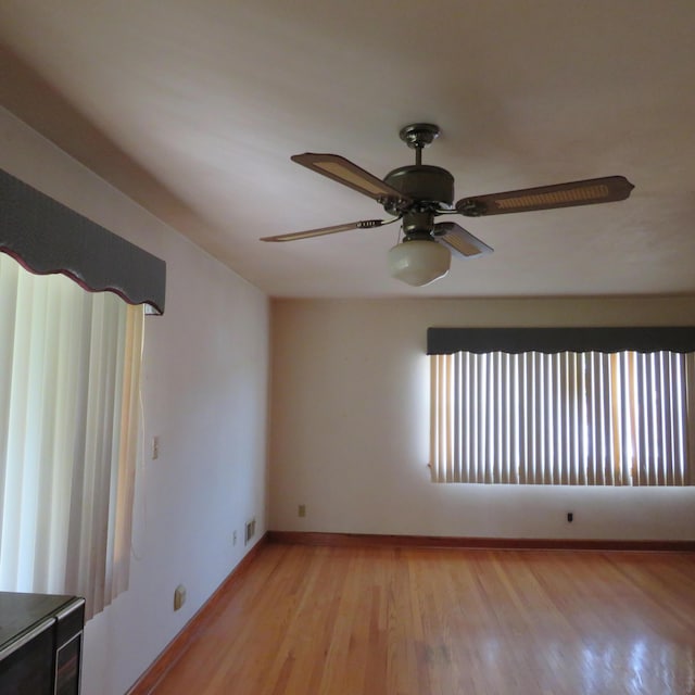 383 Main St, New Castle, VA 24127 - spare room featuring light wood-type flooring, ceiling fan, and baseboards