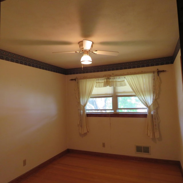 383 Main St, New Castle, VA 24127 - unfurnished room with a ceiling fan, wood finished floors, and baseboards