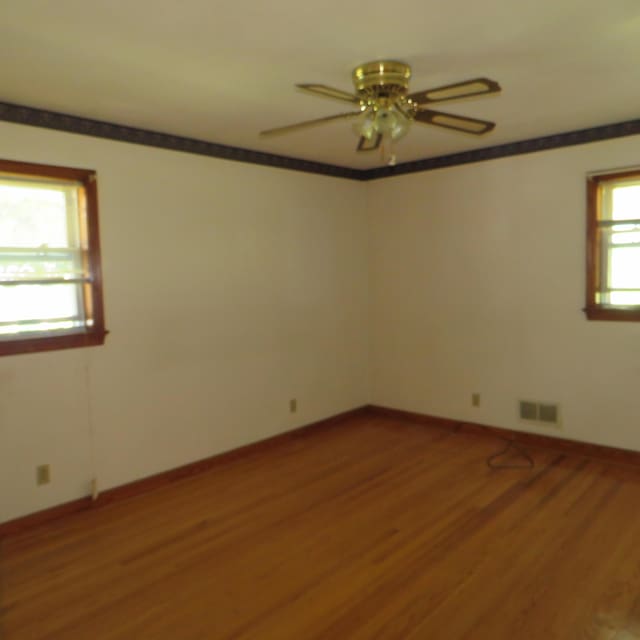 383 Main St, New Castle, VA 24127 - empty room with ceiling fan, light wood-type flooring, and baseboards