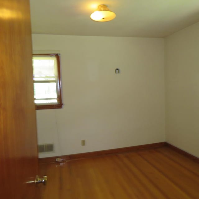 383 Main St, New Castle, VA 24127 - empty room with wood finished floors and baseboards