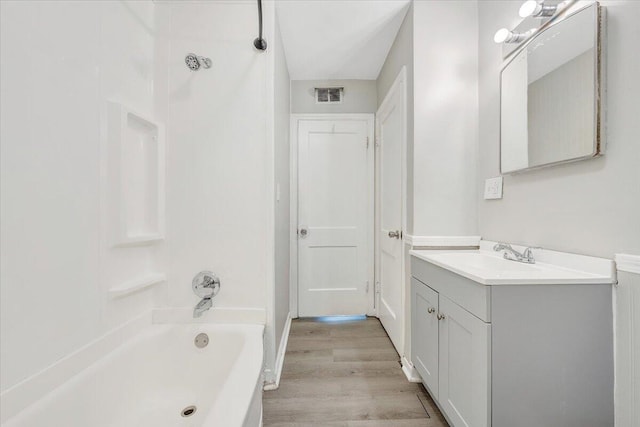 2109 Colgate St NE, Roanoke, VA 24012 - bathroom with wood finished floors, vanity, and shower / tub combination