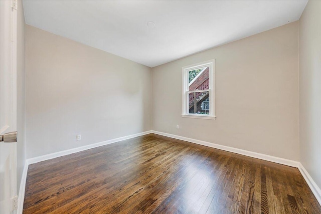 2109 Colgate St NE, Roanoke, VA 24012 - spare room with wood-type flooring and baseboards