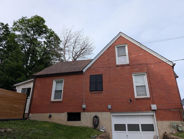 2221 W Main St, Salem, VA 24153 - view of side of property with an attached garage and brick siding