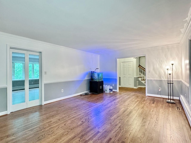 4867 Hunting Hills Dr, Roanoke, VA 24018 - unfurnished living room featuring wood finished floors, stairs, ornamental molding, baseboard heating, and baseboards