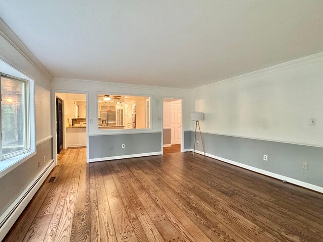 4867 Hunting Hills Dr, Roanoke, VA 24018 - unfurnished living room with baseboard heating, crown molding, wood finished floors, and baseboards