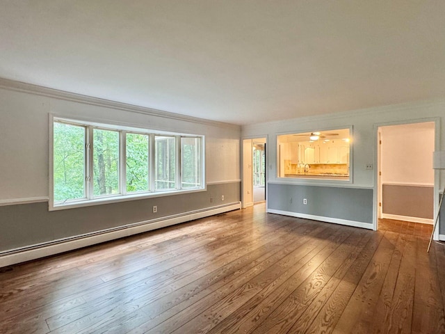 4867 Hunting Hills Dr, Roanoke, VA 24018 - unfurnished living room with a baseboard radiator, ornamental molding, wood-type flooring, and baseboards