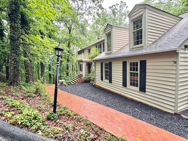 4867 Hunting Hills Dr, Roanoke, VA 24018 - view of side of property with a balcony and a shingled roof