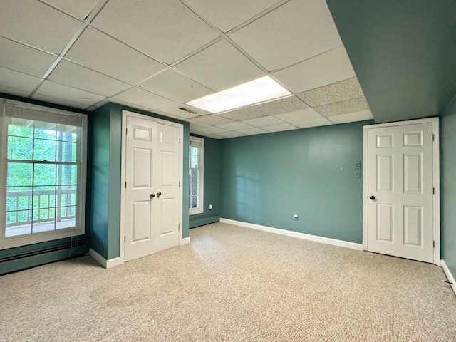 4867 Hunting Hills Dr, Roanoke, VA 24018 - empty room featuring carpet, a drop ceiling, baseboards, and a baseboard radiator