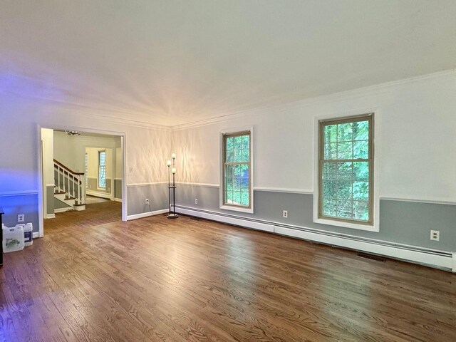 4867 Hunting Hills Dr, Roanoke, VA 24018 - unfurnished room featuring baseboard heating, crown molding, wood finished floors, and stairs