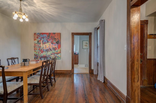 515 Elm Ave SW, Roanoke, VA 24016 - dining space featuring hardwood / wood-style floors, baseboards, and a chandelier
