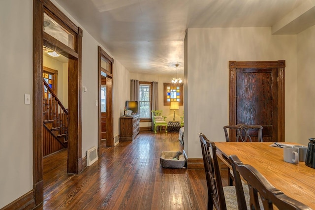 515 Elm Ave SW, Roanoke, VA 24016 - dining space with dark wood-type flooring, baseboards, and stairs