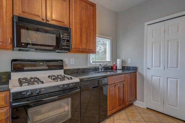 515 Elm Ave SW, Roanoke, VA 24016 - kitchen featuring black appliances, a sink, brown cabinetry, and light tile patterned flooring
