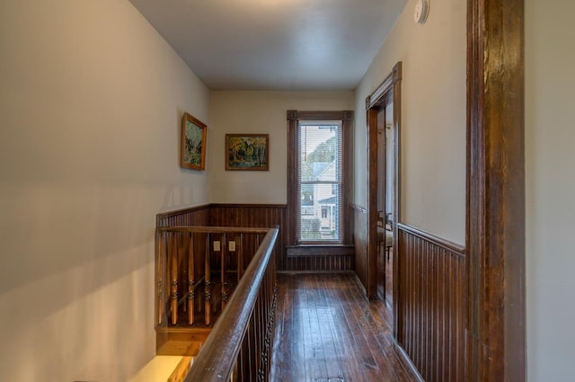515 Elm Ave SW, Roanoke, VA 24016 - hallway featuring a wainscoted wall, an upstairs landing, dark wood-type flooring, and wooden walls