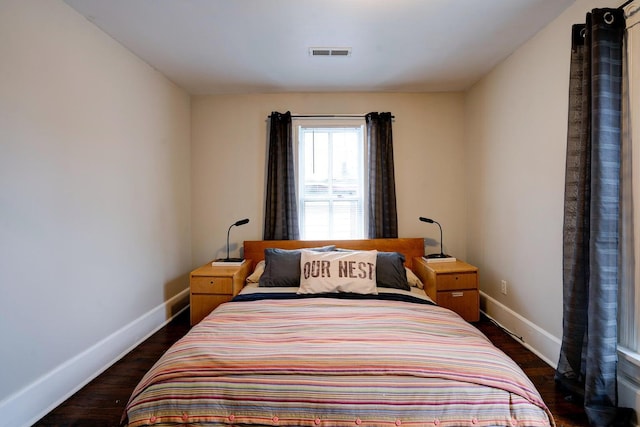 515 Elm Ave SW, Roanoke, VA 24016 - bedroom with baseboards and dark wood-style flooring