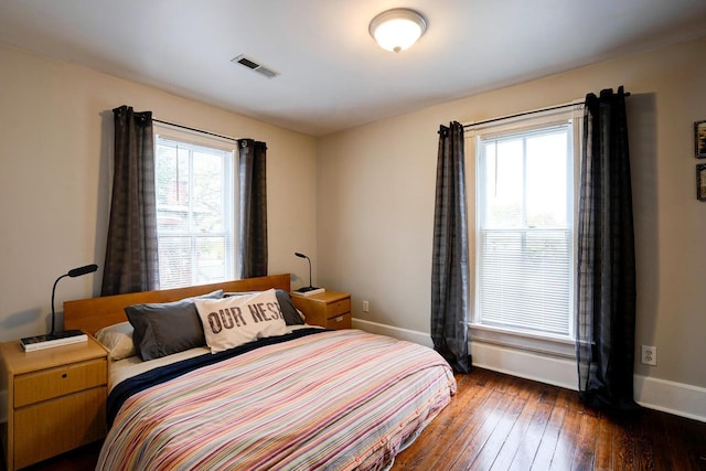 515 Elm Ave SW, Roanoke, VA 24016 - bedroom featuring multiple windows, baseboards, and dark wood-style flooring