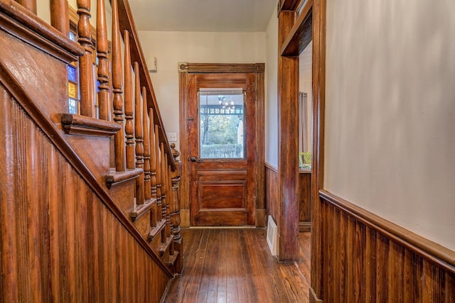 515 Elm Ave SW, Roanoke, VA 24016 - entryway featuring a wainscoted wall, dark wood-style floors, and stairs