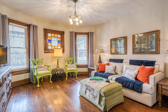 515 Elm Ave SW, Roanoke, VA 24016 - living room featuring a chandelier, hardwood / wood-style flooring, and baseboards