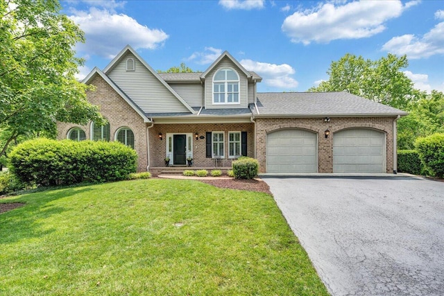 1425 Cravens Creek Ln SW, Roanoke, VA 24018 - view of front facade featuring brick siding, a garage, asphalt driveway, and a front lawn