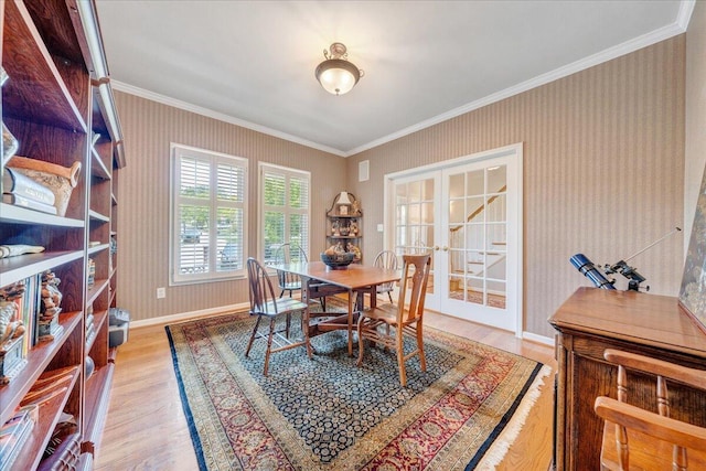 1425 Cravens Creek Ln SW, Roanoke, VA 24018 - dining room featuring light wood finished floors, ornamental molding, french doors, wallpapered walls, and baseboards