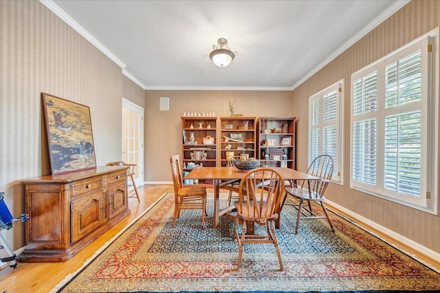 1425 Cravens Creek Ln SW, Roanoke, VA 24018 - dining area featuring light wood finished floors, baseboards, plenty of natural light, wallpapered walls, and crown molding