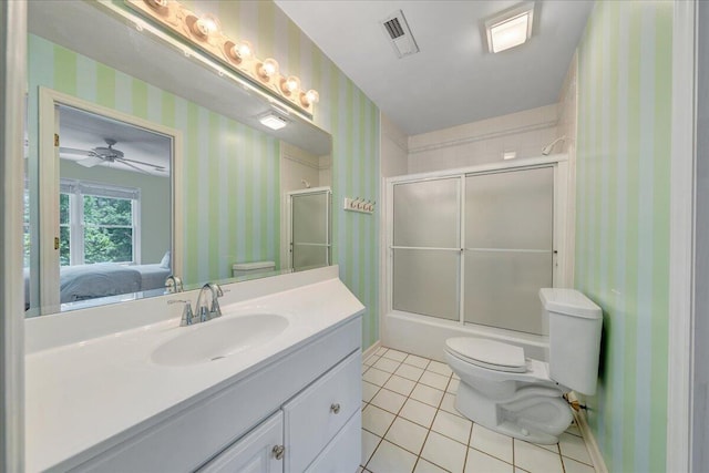 1425 Cravens Creek Ln SW, Roanoke, VA 24018 - ensuite bathroom featuring toilet, wallpapered walls, tile patterned floors, vanity, and bath / shower combo with glass door