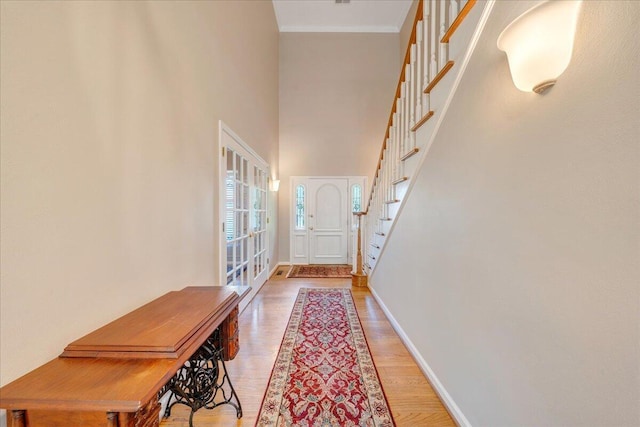 1425 Cravens Creek Ln SW, Roanoke, VA 24018 - doorway with stairway, baseboards, light wood-style floors, and a high ceiling