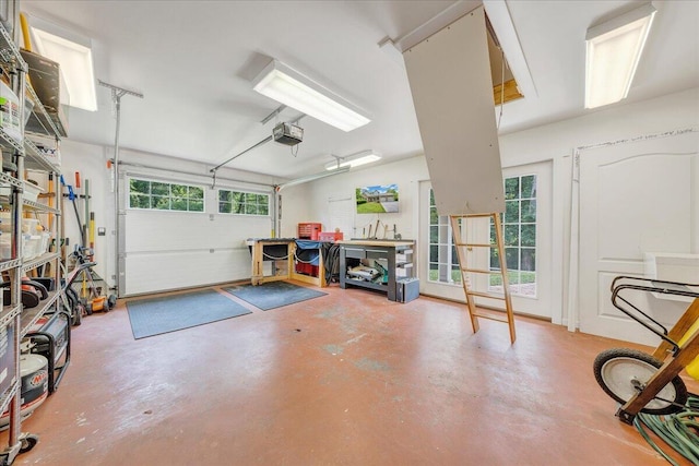 1425 Cravens Creek Ln SW, Roanoke, VA 24018 - garage featuring a garage door opener and a workshop area