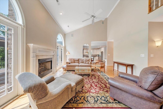 1425 Cravens Creek Ln SW, Roanoke, VA 24018 - living area with high vaulted ceiling, ornamental molding, wood finished floors, a tiled fireplace, and ceiling fan