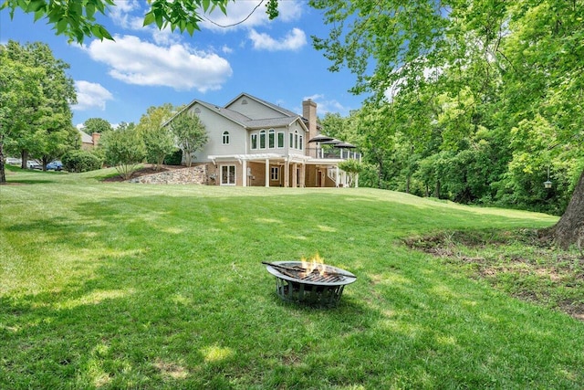 1425 Cravens Creek Ln SW, Roanoke, VA 24018 - rear view of property with a fire pit, a lawn, a chimney, and a deck