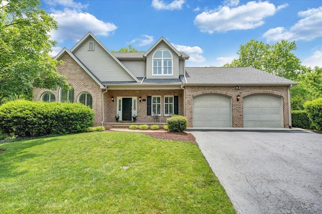 1425 Cravens Creek Ln SW, Roanoke, VA 24018 - view of front of home featuring asphalt driveway, brick siding, an attached garage, and a front yard