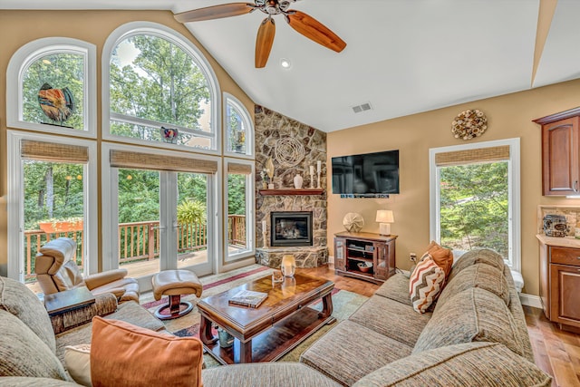 480 Winding Waters Dr, Moneta, VA 24121 - living room featuring plenty of natural light, light wood finished floors, ceiling fan, a fireplace, and high vaulted ceiling