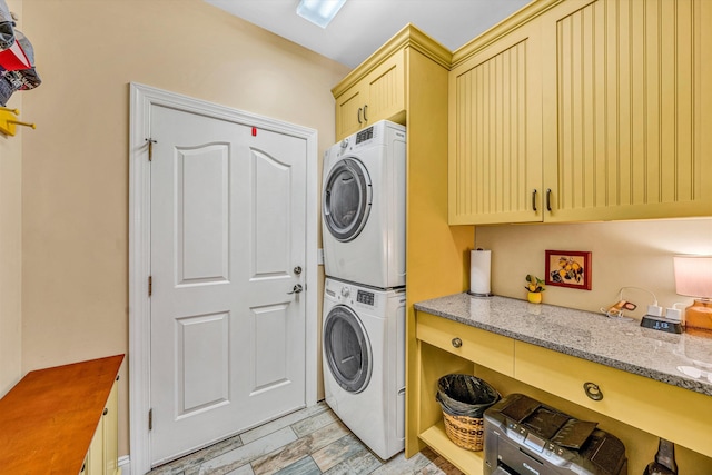 480 Winding Waters Dr, Moneta, VA 24121 - laundry room featuring stacked washing machine and dryer and cabinet space