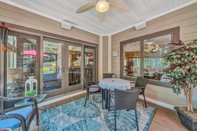 480 Winding Waters Dr, Moneta, VA 24121 - sunroom featuring wooden walls, wood-type flooring, a ceiling fan, outdoor dining area, and french doors