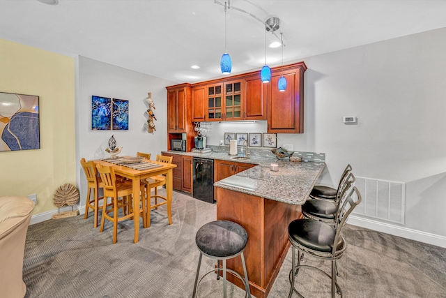 480 Winding Waters Dr, Moneta, VA 24121 - kitchen with light colored carpet, a kitchen bar, baseboards, black microwave, and recessed lighting