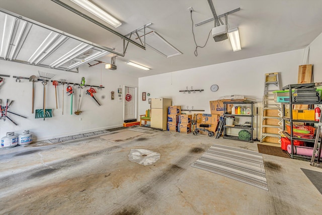 480 Winding Waters Dr, Moneta, VA 24121 - garage with a garage door opener and freestanding refrigerator