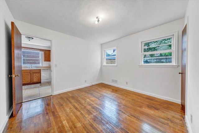 1113 Brandon Ave SW, Roanoke, VA 24015 - unfurnished bedroom featuring light wood finished floors and baseboards